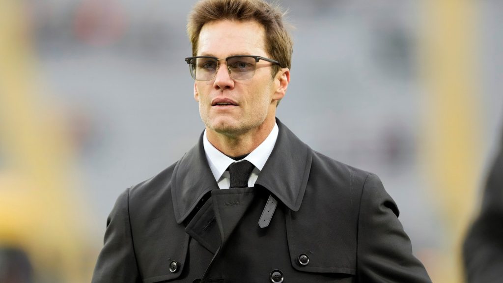 tom-brady-walks-across-field-951925827.jpg